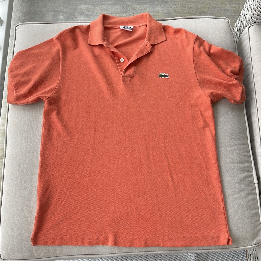 Lacoste men’s size 4 orange short sleeve polo shirt. Size 4 is a medium